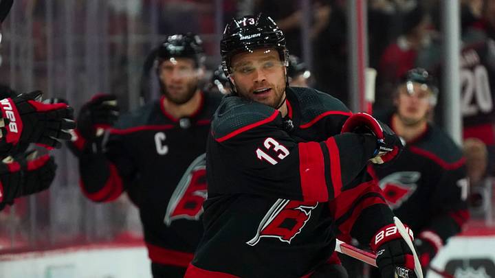 May 14, 2022; Raleigh, North Carolina, USA; Carolina Hurricanes center Max Domi (13) celebrates his goal against the Boston Bruins during the second period in game seven of the first round of the 2022 Stanley Cup Playoffs at PNC Arena. Mandatory Credit: James Guillory-USA TODAY Sports