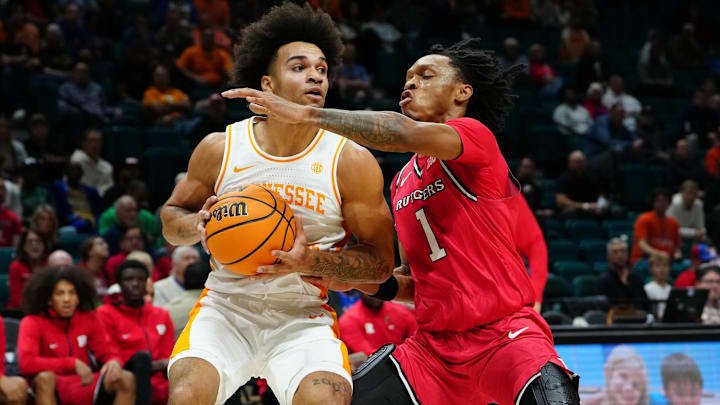 Nov 24, 2025; Las Vegas, NV, USA; Tennessee Volunteers guard Ja'Kobi Gillespie (0) is defended by Rutgers Scarlet Knights guard Jamichael Davis (1) during the first half in a 2025 Players Era Festival group play game at MGM Grand Garden Arena. Mandatory Credit: Stephen R. Sylvanie-Imagn Images Nov 24, 2025; Las Vegas, NV, USA; Tennessee Volunteers guard Ja'Kobi Gillespie (0) is defended by Rutgers Scarlet Knights guard Jamichael Davis (1) during the first half in a 2025 Players Era Festival group play game at MGM Grand Garden Arena. Mandatory Credit: Stephen R. Sylvanie-Imagn Images