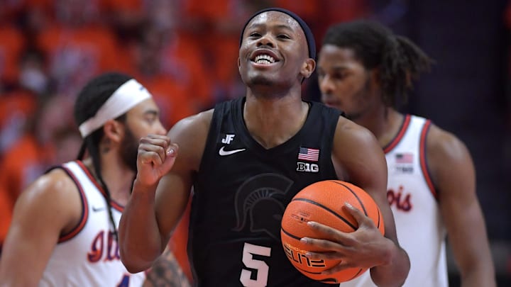 Feb 15, 2025; Champaign, Illinois, USA;  Michigan State Spartans guard Tre Holloman (5) reacts after a win over the Illinois Fighting Illini at State Farm Center. Mandatory Credit: Ron Johnson-Imagn Images