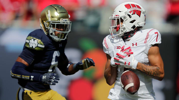 Wisconsin Badgers wide receiver Danny Davis III (7) drops a pass against Notre Dame Fighting Irish cornerback Clarence Lewis (6) during their football game Saturday, September 25, 2021, at Soldier Field in Chicago, Ill. 