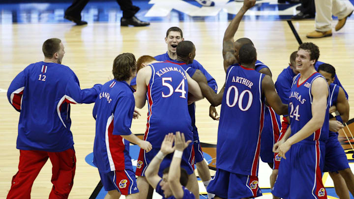 Apr 7, 2008; San Antonio, TX, USA; Members of the Kansas Jayhawks celebrate after defeating the Memphis Tigers in the finals of the 2008 NCAA Mens Final Four Championship at the Alamodome. Kansas defeated Memphis 75-68 in overtime to win the national championship. Apr 7, 2008; San Antonio, TX, USA; Members of the Kansas Jayhawks celebrate after defeating the Memphis Tigers in the finals of the 2008 NCAA Mens Final Four Championship at the Alamodome. Kansas defeated Memphis 75-68 in overtime to win the national championship.