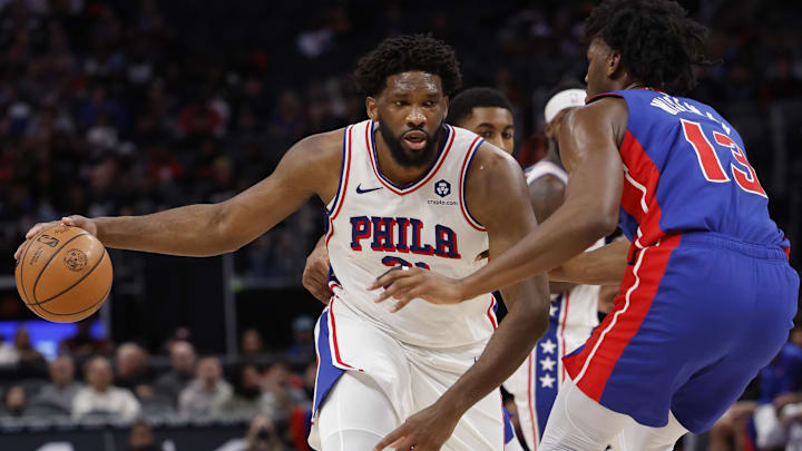 Dec 13, 2023; Detroit, Michigan, USA;  Philadelphia 76ers center Joel Embiid (21) is defended by