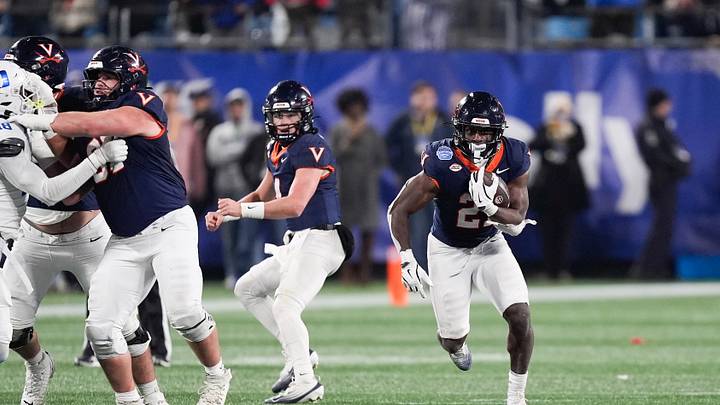 Dec 6, 2025; Charlotte, NC, USA; Virginia Cavaliers running back Harrison Waylee (21) runs with the ball in the second half against the Duke Blue Devils during the 2025 ACC Championship game at Bank of America Stadium. Mandatory Credit: Jim Dedmon-Imagn Images Dec 6, 2025; Charlotte, NC, USA; Virginia Cavaliers running back Harrison Waylee (21) runs with the ball in the second half against the Duke Blue Devils during the 2025 ACC Championship game at Bank of America Stadium. Mandatory Credit: Jim Dedmon-Imagn Images