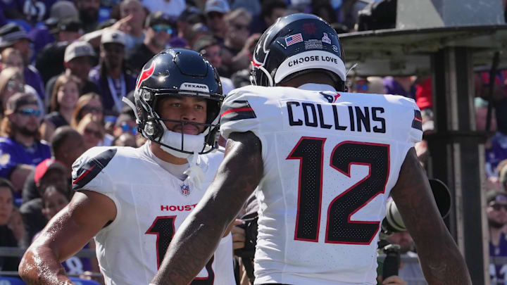 Oct 5, 2025; Baltimore, Maryland, USA; Houston Texans wide receiver Xavier Hutchinson (19) and wide receiver Nico Collins (12) celebrate a touchdown during the first quarter against the Baltimore Ravens at M&T Bank Stadium. Mandatory Credit: Mitch Stringer-Imagn Images