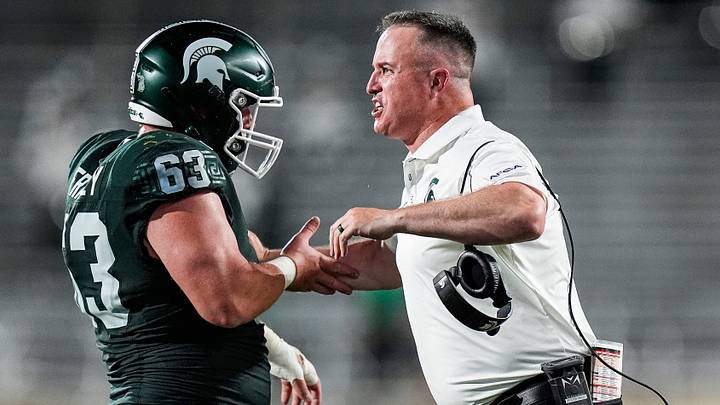 Michigan State head coach Pat Fitzgerald celebrates a play against Toledo with offensive lineman Trent Fraley (63) during the first half at Spartan Stadium in East Lansing on Friday, Sept. 4, 2026. Michigan State head coach Pat Fitzgerald celebrates a play against Toledo with offensive lineman Trent Fraley (63) during the first half at Spartan Stadium in East Lansing on Friday, Sept. 4, 2026.