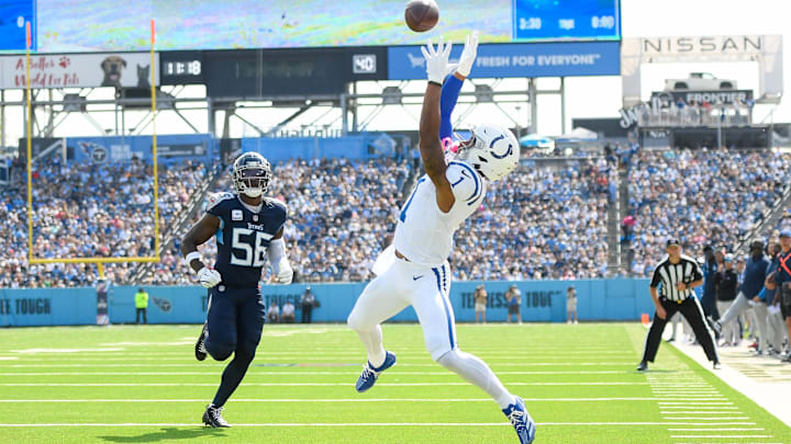 Oct 13, 2024; Nashville, Tennessee, USA; Indianapolis Colts wide receiver Josh Downs (1) makes a touchdown catch over Tennessee Titans linebacker Kenneth Murray Jr. (56) during the first half at Nissan Stadium. Mandatory Credit: Steve Roberts-Imagn Images Oct 13, 2024; Nashville, Tennessee, USA; Indianapolis Colts wide receiver Josh Downs (1) makes a touchdown catch over Tennessee Titans linebacker Kenneth Murray Jr. (56) during the first half at Nissan Stadium. Mandatory Credit: Steve Roberts-Imagn Images