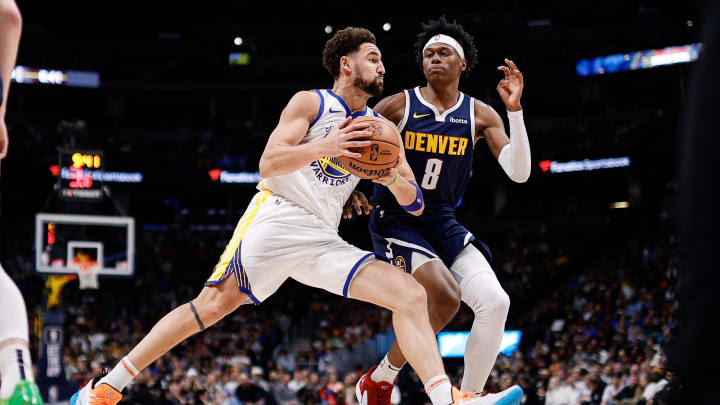 Nov 8, 2023; Denver, Colorado, USA; Golden State Warriors guard Klay Thompson (11) controls the ball against Denver Nuggets forward Peyton Watson (8) in the second quarter at Ball Arena. Mandatory Credit: Isaiah J. Downing-USA TODAY Sports Nov 8, 2023; Denver, Colorado, USA; Golden State Warriors guard Klay Thompson (11) controls the ball against Denver Nuggets forward Peyton Watson (8) in the second quarter at Ball Arena. Mandatory Credit: Isaiah J. Downing-USA TODAY Sports