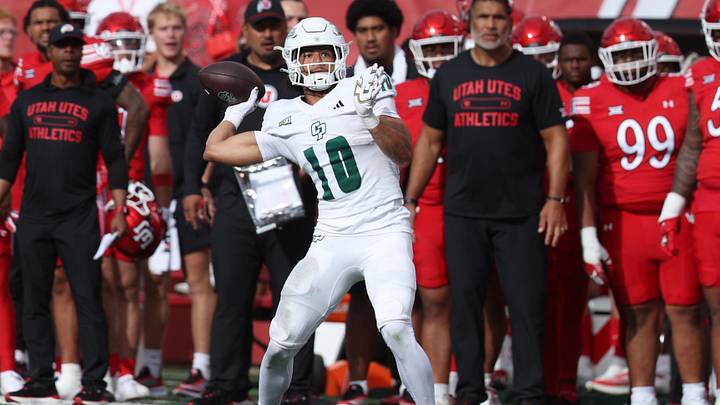Sep 6, 2025; Salt Lake City, Utah, USA; Cal Poly Mustangs wide receiver Michael Briscoe (10) catches a pass and then passes the ball against the Utah Utes during the second quarter at Rice-Eccles Stadium. 