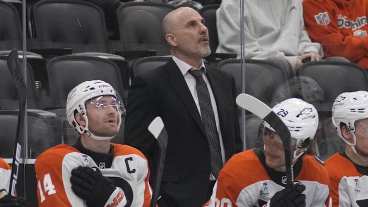 Mar 2, 2026; Toronto, Ontario, CAN; Philadelphia Flyers head coach Rick Tocchet (center) looks up at the scoreboard during a game against the Toronto Maple Leafs at Scotiabank Arena. Mandatory Credit: John E. Sokolowski-Imagn Images Mar 2, 2026; Toronto, Ontario, CAN; Philadelphia Flyers head coach Rick Tocchet (center) looks up at the scoreboard during a game against the Toronto Maple Leafs at Scotiabank Arena. Mandatory Credit: John E. Sokolowski-Imagn Images