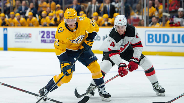 Feb 13, 2024; Nashville, Tennessee, USA;  New Jersey Devils defenseman Colin Miller (24) and right