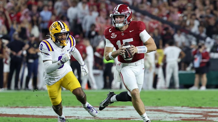Nov 8, 2025; Tuscaloosa, Alabama, USA; Alabama Crimson Tide quarterback Ty Simpson (15) scrambles with the ball defended by Louisiana State Tigers safety Tamarcus Cooley (0) during the first quarter of the game at Saban Field at Bryant-Denny Stadium. Mandatory Credit: David Leong-Imagn Images Nov 8, 2025; Tuscaloosa, Alabama, USA; Alabama Crimson Tide quarterback Ty Simpson (15) scrambles with the ball defended by Louisiana State Tigers safety Tamarcus Cooley (0) during the first quarter of the game at Saban Field at Bryant-Denny Stadium. Mandatory Credit: David Leong-Imagn Images