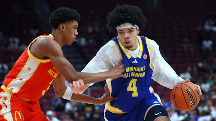 Mar 31, 2026; Glendale, AZ, USA; Tyran Stokes (4) moves the ball against Bruce Branch III (3) during the McDonalds All American Boys Game at Desert Diamond Arena. Mandatory Credit: Mark J. Rebilas-Imagn Images