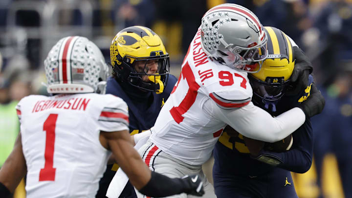Ohio State Buckeyes defensive end Kenyatta Jackson Jr. (97) tackles Michigan Wolverines quarterback Bryce Underwood (19)