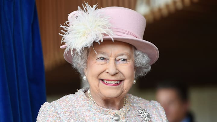 Does the Queen have any strong allegiances to football clubs?