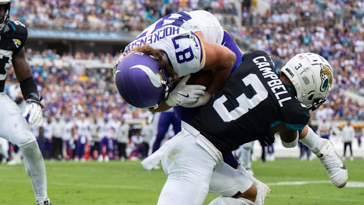 Nov 10, 2024; Jacksonville, Florida, USA; Jacksonville Jaguars cornerback Tyson Campbell (3) tackles Minnesota Vikings tight end T.J. Hockenson (87) after the catch in the second quarter at EverBank Stadium. 