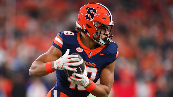 Nov 30, 2024; Syracuse, New York, USA; Syracuse Orange tight end Oronde Gadsden II (19) runs with the ball after a catch against the Miami Hurricanes during the first half at the JMA Wireless Dome. Mandatory Credit: Rich Barnes-Imagn Images
