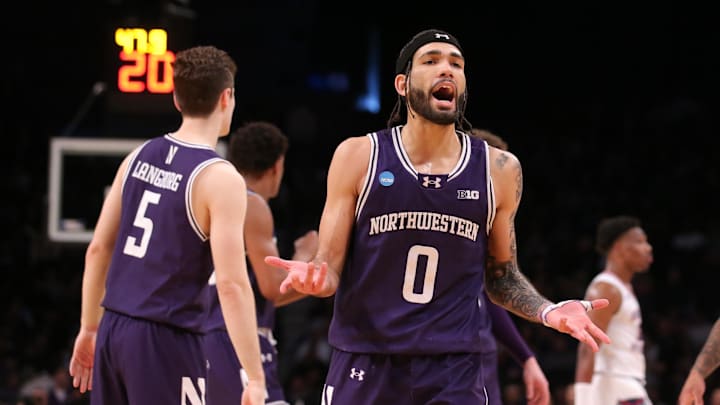 March 22, 2024, Brooklyn, NY, USA; Northwestern Wildcats guard Boo Buie (0) reacts against the Florida Atlantic Owls  in the first round of the 2024 NCAA Tournament at the Barclays Center. Mandatory Credit: Brad Penner-Imagn Images