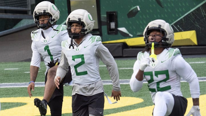 Oregon’s Dakorien Moore, left, Gary Bryant Jr. and Jay Harris work out during practice at Autzen Stadium in Eugene Dec. 14, 2025 before the first-round CFP game against James Madison. Oregon’s Dakorien Moore, left, Gary Bryant Jr. and Jay Harris work out during practice at Autzen Stadium in Eugene Dec. 14, 2025 before the first-round CFP game against James Madison.
