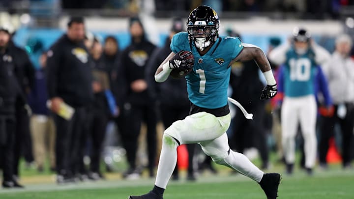 Jan 14, 2023; Jacksonville, Florida, USA; Jacksonville Jaguars running back Travis Etienne Jr. (1)