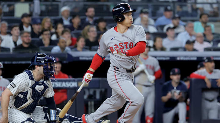 Sep 30, 2025; Bronx, New York, USA; Boston Red Sox left fielder Masataka Yoshida (7) follows through on a two run single against the New York Yankees during the seventh inning of game one of the Wildcard round of the 2025 MLB playoffs at Yankee Stadium. Mandatory Credit: Brad Penner-Imagn Images
