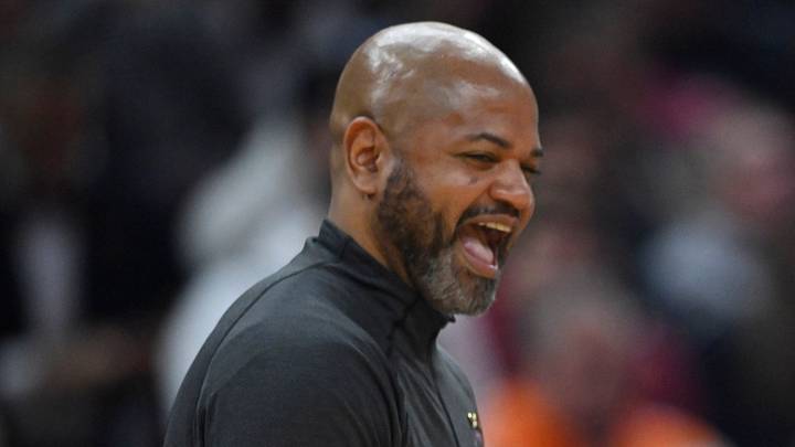 Mar 15, 2023; Cleveland, Ohio, USA; Cleveland Cavaliers head coach J. B. Bickerstaff (left) laughs with referee Derek Richardson (right) in the second quarter against the Philadelphia 76ers at Rocket Mortgage FieldHouse. Mandatory Credit: David Richard-USA TODAY Sports