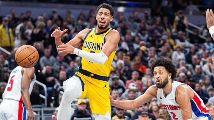 Nov 29, 2024; Indianapolis, Indiana, USA; Indiana Pacers guard Tyrese Haliburton (0) loses the ball while Detroit Pistons guard Cade Cunningham (2) defends in the first half  at Gainbridge Fieldhouse. Mandatory Credit: Trevor Ruszkowski-Imagn Images