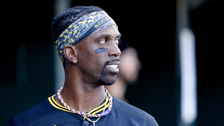 Jun 19, 2025; Detroit, Michigan, USA;  Pittsburgh Pirates designated hitter Andrew McCutchen (22) in the dugout in the sixth inning against the Detroit Tigers at Comerica Park. Mandatory Credit: Rick Osentoski-Imagn Images