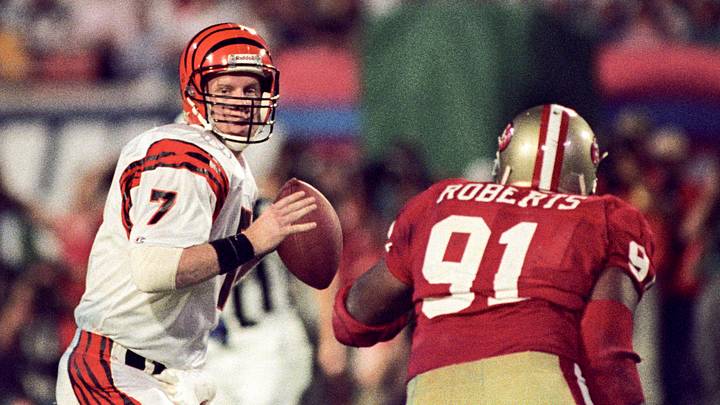 Jan 22, 1989; Miami, FL, USA; FILE PHOTO; Cincinnati Bengals quarterback Boomer Esiason (7) looks to pass while under pressure from San Francisco 49ers defensive end Larry Roberts (91) during Super Bowl XXIII at Joe Robbie Stadium. The 49ers defeated the Bengals 20-16. Mandatory Credit: Bob Deutsch-USA TODAY Sports