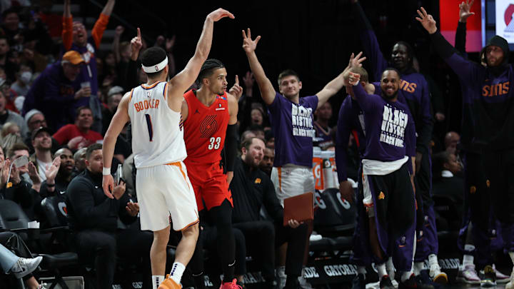Feb 3, 2025; Portland, Oregon, USA;  Phoenix Suns guard Devin Booker (1) reacts after scoring against the Portland Trail Blazers to make Booker the Suns’ all-time leading scorer in the second half at Moda Center. Mandatory Credit: Jaime Valdez-Imagn Images