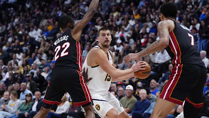 Nov 5, 2025; Denver, Colorado, USA; Miami Heat forward Andrew Wiggins (22) and center Kel'el Ware (7) defend on Denver Nuggets center Nikola Jokic (15) in the second quarter at Ball Arena. Mandatory Credit: Ron Chenoy-Imagn Images Nov 5, 2025; Denver, Colorado, USA; Miami Heat forward Andrew Wiggins (22) and center Kel'el Ware (7) defend on Denver Nuggets center Nikola Jokic (15) in the second quarter at Ball Arena. Mandatory Credit: Ron Chenoy-Imagn Images