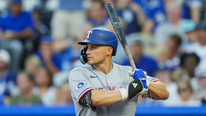 Aug 18, 2025; Kansas City, Missouri, USA; Texas Rangers shortstop Corey Seager (5) bats during the third inning against the Kansas City Royals at Kauffman Stadium. Mandatory Credit: Jay Biggerstaff-Imagn Images