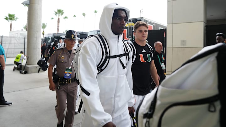 Dec 28, 2024; Orlando, FL, USA; Miami Hurricanes quarterback Cam Ward (1) arrives prior to the game against the Iowa State Cyclones at Camping World Stadium. Mandatory Credit: Jasen Vinlove-Imagn Images