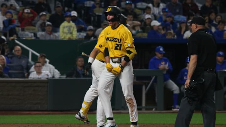 March 19, 2024; Kansas City, Missouri, USA; Missouri Tigers shortstop Jackson Lovich celebrates a run against the Kansas Jayhawks at Kauffman Stadium.