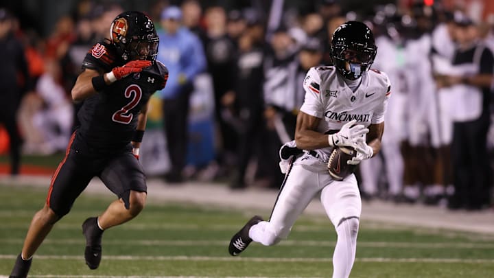 Nov 1, 2025; Salt Lake City, Utah, USA; Cincinnati Bearcats wide receiver Cyrus Allen (4) makes a catch against Utah Utes cornerback Smith Snowden (2) during the second quarter at Rice-Eccles Stadium. Mandatory Credit: Rob Gray-Imagn Images