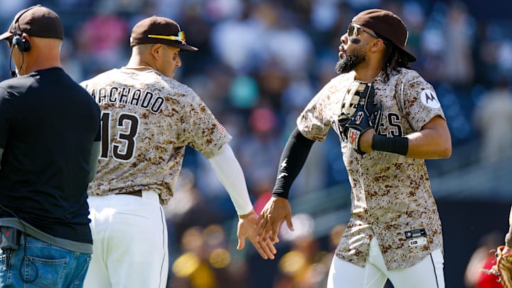 Apr 13, 2025; San Diego, California, USA; San Diego Padres right fielder Fernando Tatis Jr. (23) celebrates with San Diego Padres third baseman Manny Machado (13) after defeating the Colorado Rockies at Petco Park. Mandatory Credit: David Frerker-Imagn Images