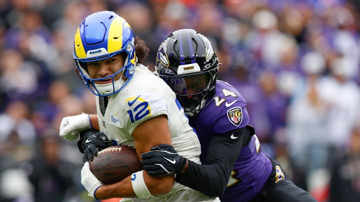 Oct 12, 2025; Baltimore, Maryland, USA; Baltimore Ravens safety Malaki Starks (24) tackles Los Angeles Rams wide receiver Puka Nacua (12) during the second quarter of the game at M&T Bank Stadium. Mandatory Credit: Peter Casey-Imagn Images Oct 12, 2025; Baltimore, Maryland, USA; Baltimore Ravens safety Malaki Starks (24) tackles Los Angeles Rams wide receiver Puka Nacua (12) during the second quarter of the game at M&T Bank Stadium. Mandatory Credit: Peter Casey-Imagn Images