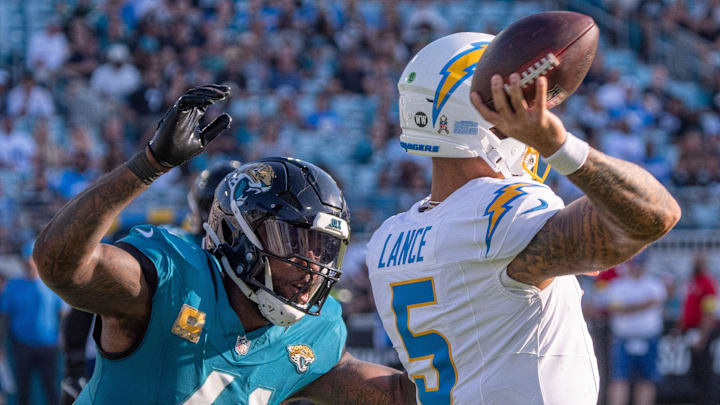 Jacksonville Jaguars defensive end Josh Hines-Allen (41) attempts to sack Los Angeles Chargers quarterback Trey Lance (5) during the fourth quarter in an NFL football game at EverBank Stadium, Sunday, November 16, 2025, in Jacksonville, Fla. [Doug Engle/Florida Times-Union]