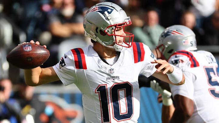 Nov 10, 2024; Chicago, Illinois, USA; New England Patriots quarterback Drake Maye (10) drops back to pass against the Chicago Bears during the first quarter at Soldier Field. Mandatory Credit: Mike Dinovo-Imagn Images