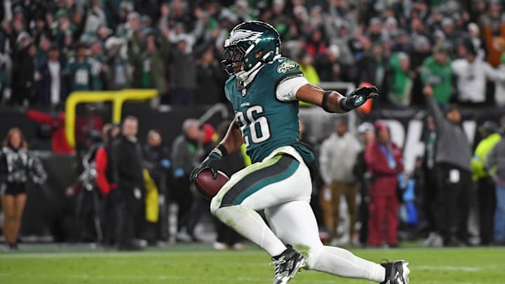 Nov 14, 2024; Philadelphia, Pennsylvania, USA; Philadelphia Eagles running back Saquon Barkley (26) scores on a 39-yard touchdown run during the fourth quarter against the Washington Commanders at Lincoln Financial Field. Mandatory Credit: Eric Hartline-Imagn Images