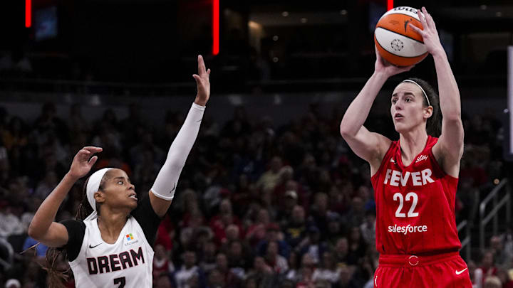 Sep 8, 2024; Indianapolis, Indiana, USA; Indiana Fever guard Caitlin Clark (22) shoots a 3-pointer Sunday, Sept. 8, 2024, during a game between the Indiana Fever and the Atlanta Dream at Gainbridge Fieldhouse. Mandatory Credit: Grace Smith/USA TODAY Network via Imagn Images