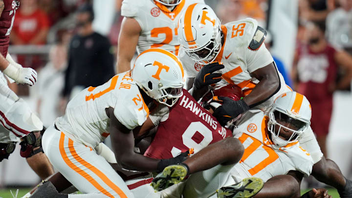 Oklahoma Sooners quarterback Michael Hawkins Jr. (9) is brought down by Tennessee Volunteers defensive lineman James Pearce Jr. (27), defensive lineman Omarr Norman-Lott (55) and defensive lineman Jayson Jenkins (97) during a college football game between the University of Oklahoma Sooners (OU) and the Tennessee Volunteers at Gaylord Family - Oklahoma Memorial Stadium in Norman, Okla., Saturday, Sept. 21, 2024.