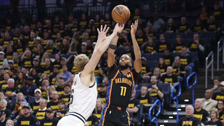 May 7, 2025; Oklahoma City, Oklahoma, USA; Oklahoma City Thunder guard Isaiah Joe (11) shoots a three point basket over Denver Nuggets forward Hunter Tyson (5) in the second half during game two of the second round for the 2025 NBA Playoffs at Paycom Center. Mandatory Credit: Alonzo Adams-Imagn Images