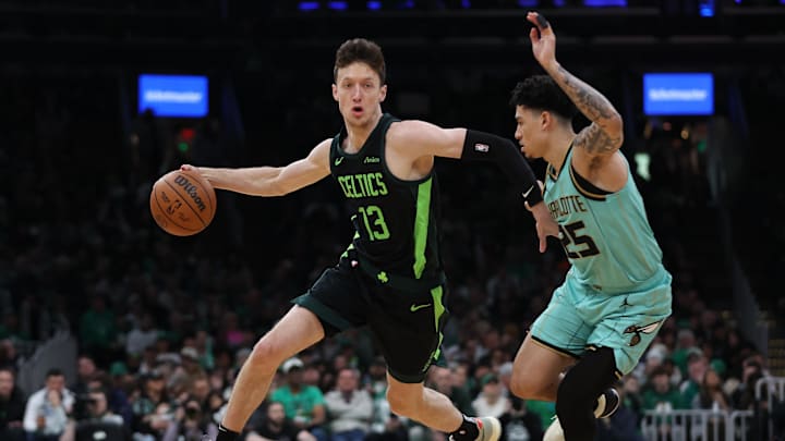 Apr 13, 2025; Boston, Massachusetts, USA; Boston Celtics forward Drew Peterson (13) dribbles down the court during the first half against the Charlotte Hornets at TD Garden. Mandatory Credit: Paul Rutherford-Imagn Images Apr 13, 2025; Boston, Massachusetts, USA; Boston Celtics forward Drew Peterson (13) dribbles down the court during the first half against the Charlotte Hornets at TD Garden. Mandatory Credit: Paul Rutherford-Imagn Images