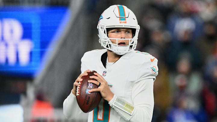 Jan 4, 2026; Foxborough, Massachusetts, USA; Miami Dolphins quarterback Zach Wilson (0) looks to throw a pass against the New England Patriots during the fourth quarter at Gillette Stadium. Mandatory Credit: Brian Fluharty-Imagn Images