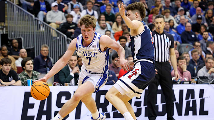 Mar 27, 2025; Newark, NJ, USA; Duke Blue Devils guard Kon Knueppel (7) shoots the ball against Arizona Wildcats guard Anthony Dell'Orso (3) during the first half during an East Regional semifinal of the 2025 NCAA tournament at Prudential Center. Mandatory Credit: Vincent Carchietta-Imagn Images