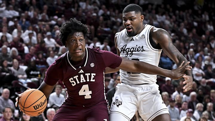 Jan 21, 2026; College Station, Texas, USA; Mississippi State Bulldogs forward Brandon Walker (4) looks to pass the ball as Texas A&M Aggies forward Rashaun Agee (12) defends during the second half at Reed Arena. Mandatory Credit: Maria Lysaker-Imagn Images 