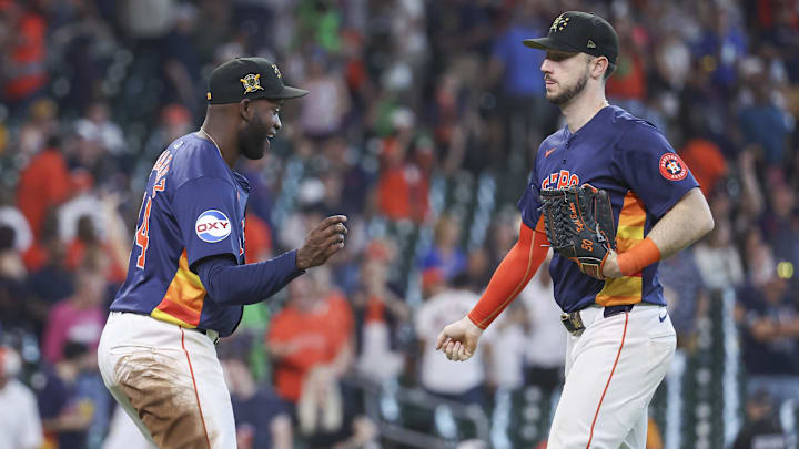 May 19, 2024; Houston, Texas, USA; Houston Astros right fielder Kyle Tucker (30) celebrates with designated hitter Yordan Alvarez (44) after the game against the Milwaukee Brewers at Minute Maid Park.