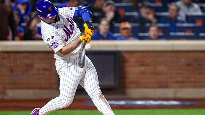 Oct 18, 2024; New York City, New York, USA; New York Mets first baseman Pete Alonso (20) singles during the eighth inning against the Los Angeles Dodgers during game five of the NLCS for the 2024 MLB playoffs at Citi Field. Mandatory Credit: Vincent Carchietta-Imagn Images