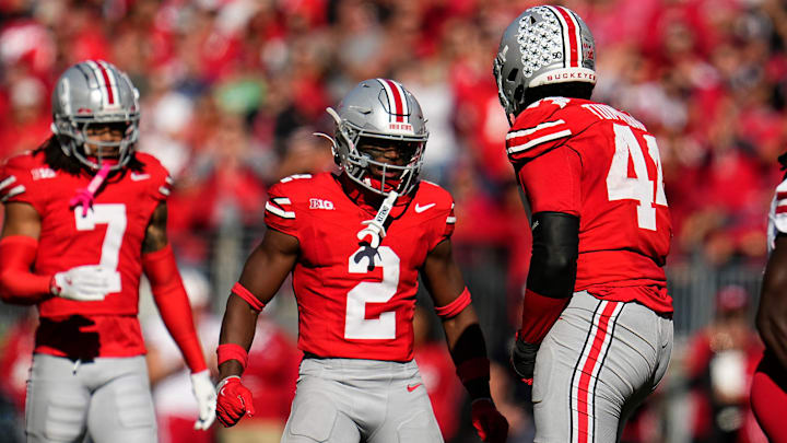 Ohio State Buckeyes safety Caleb Downs (2) celebrates a tackle by defensive end JT Tuimoloau (44) during the second half of the NCAA football game against the Nebraska Cornhuskers at Ohio Stadium in Columbus on Saturday, Oct. 26, 2024. Ohio State won 21-17.