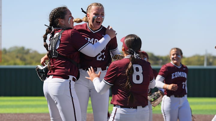 Edmond Memorial's Keegan Baker, center, celebrates with Beth Damon, left, and Ava Garcia during a Class 6A state fastpitch softball game between Edmond Memorial and Owasso in Shawnee, Okla., Friday, Oct. 13, 2023.
